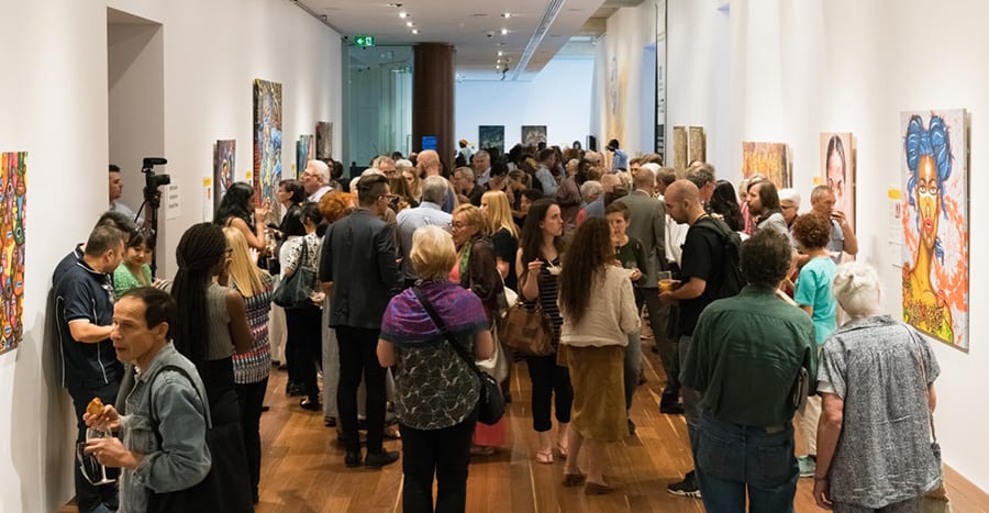 Crowd admiring artwork at SANAA 2019 Exhibition Opening