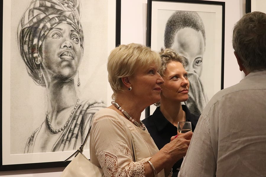Victoria Lewis with guests at SANAA Exhibition 2019 opening