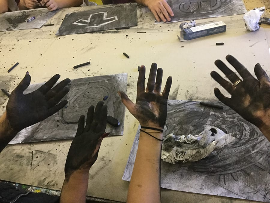 SANAA workshop creating artwork with hands